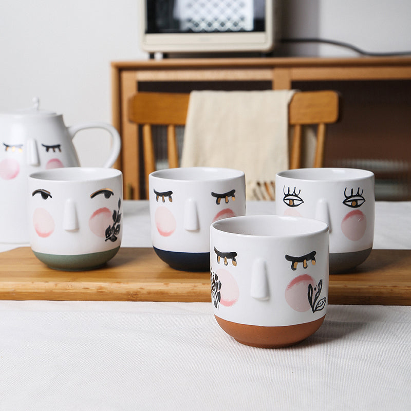 Watercolor style cute face teapot set