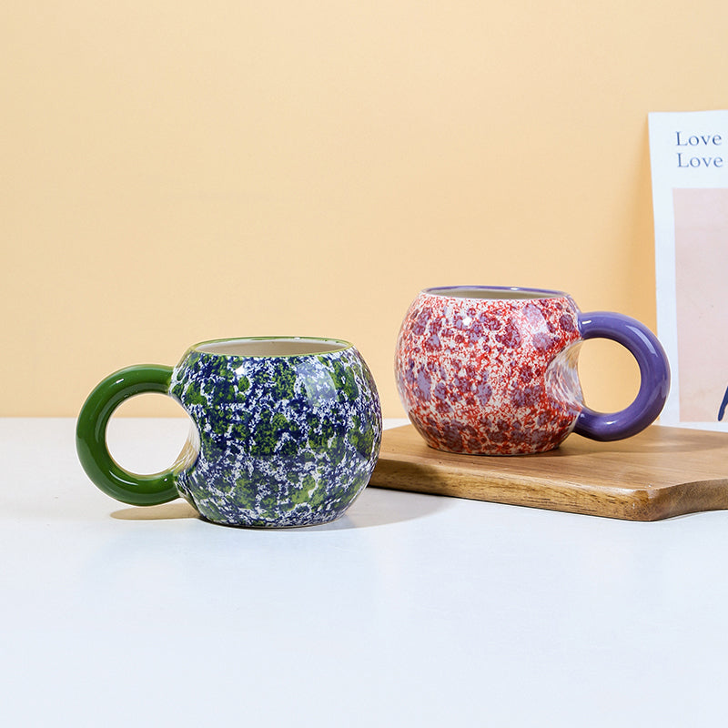 Finger-painted creative cups in various colors