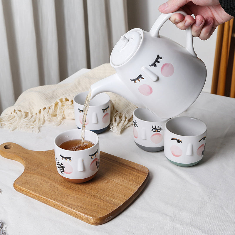 Watercolor style cute face teapot set